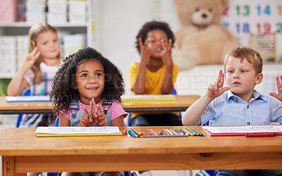 Buy stock photo Shot of a group of preschool students sitting in a classroom