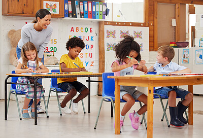 Buy stock photo Shot of a young woman teaching a class of preschool children