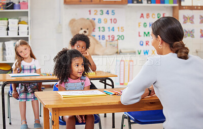 Buy stock photo Shot of a young woman teaching a class of preschool children