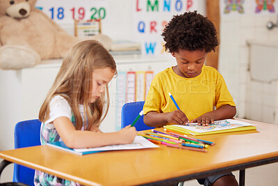Buy stock photo Shot of preschool students colouring in class