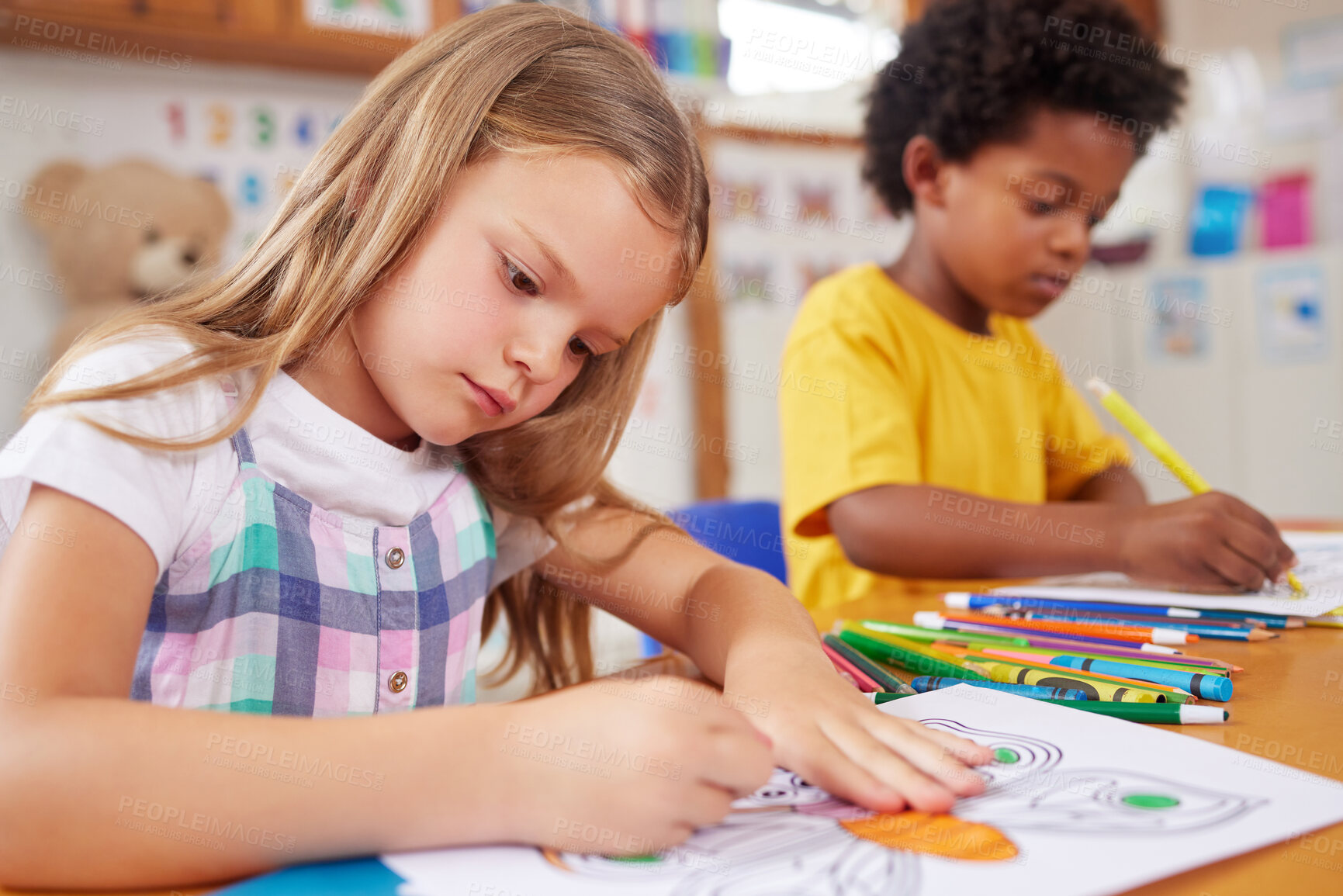 Buy stock photo Shot of preschool students colouring in class