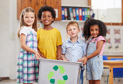 Buy stock photo Shot of a group of preschoolers holding a recycling bin in class