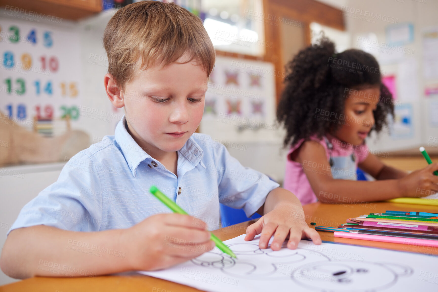 Buy stock photo Shot of preschool students colouring in class