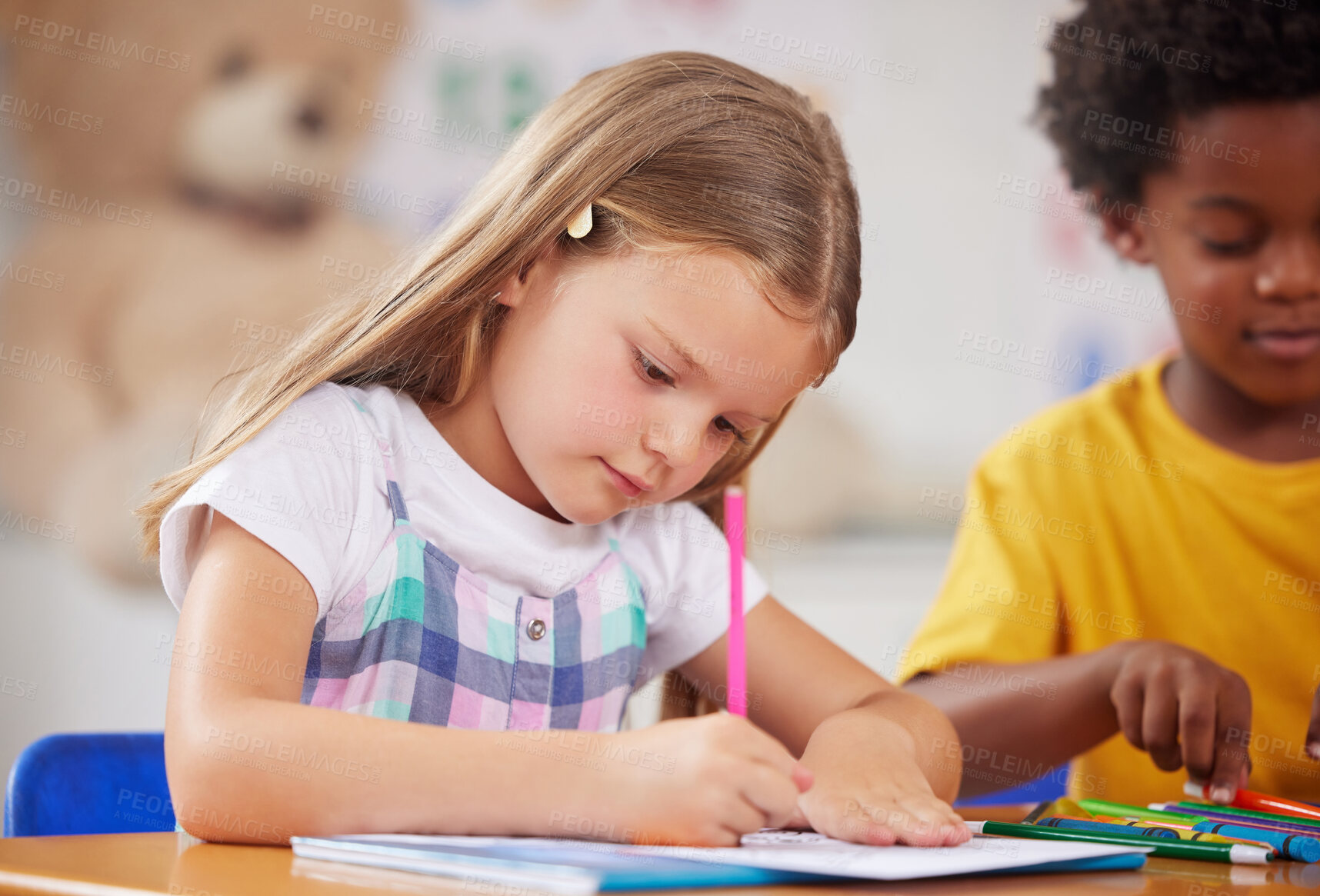 Buy stock photo Shot of a preschooler colouring in class