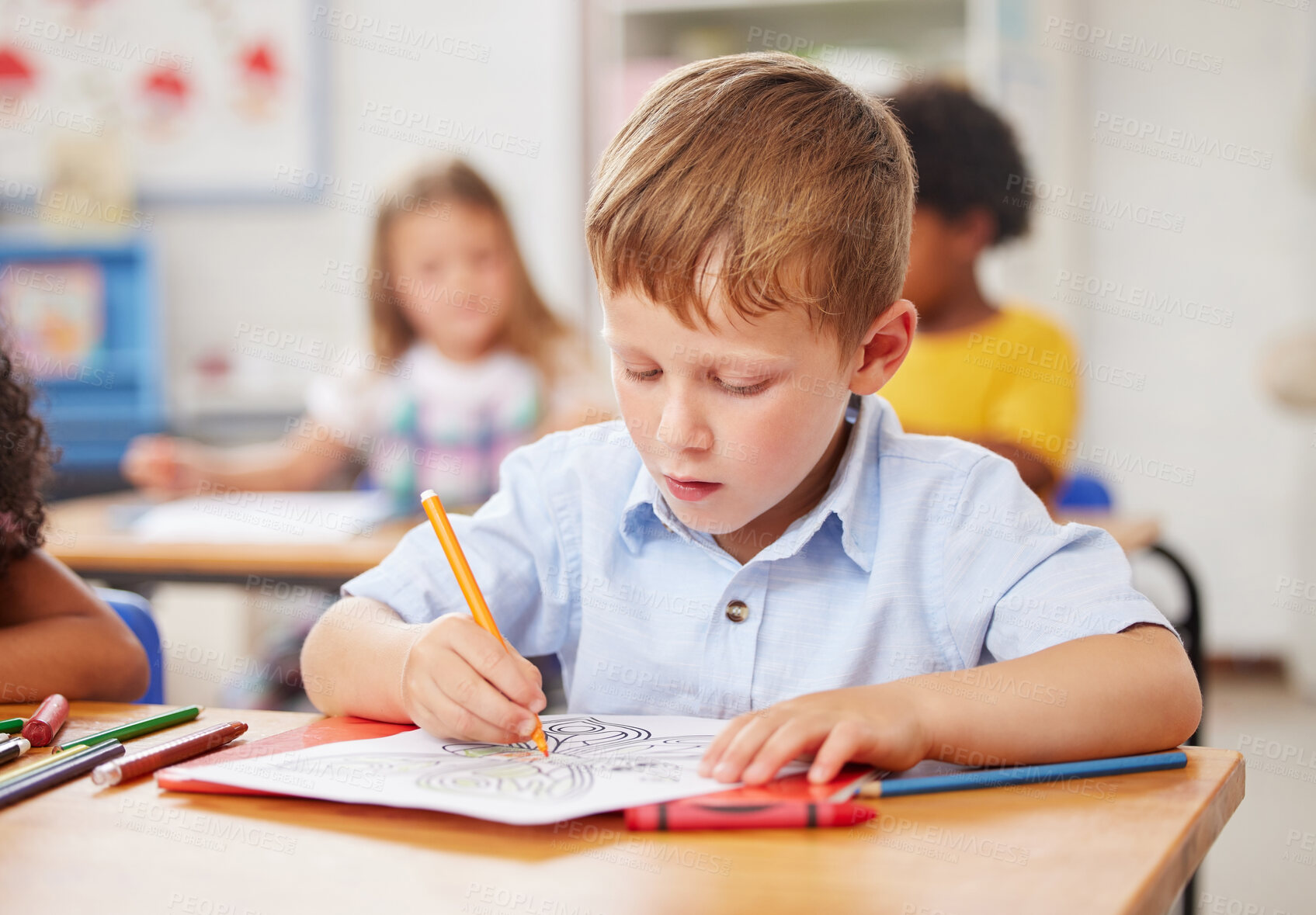 Buy stock photo Shot of a preschooler colouring in class