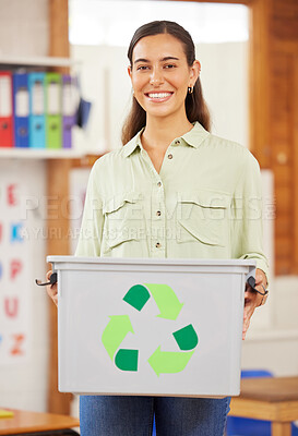 Buy stock photo Shot of a female teacher holding up a recycling bin