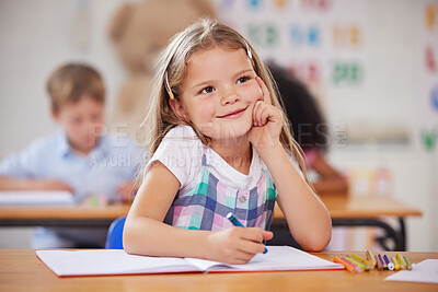 Buy stock photo Shot of a preschool student looking thoughtful while sitting in class