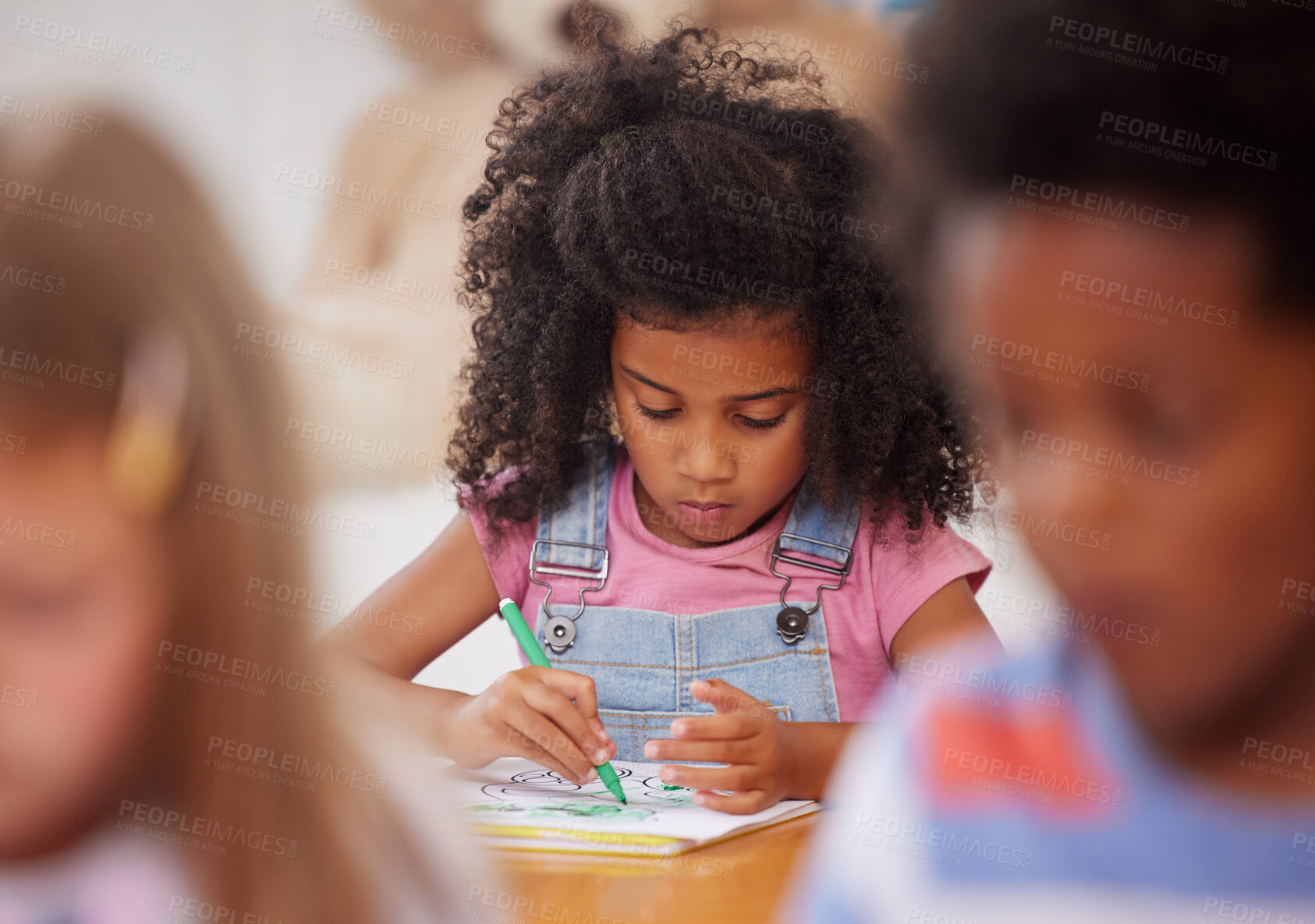 Buy stock photo Shot of a preschooler colouring in class