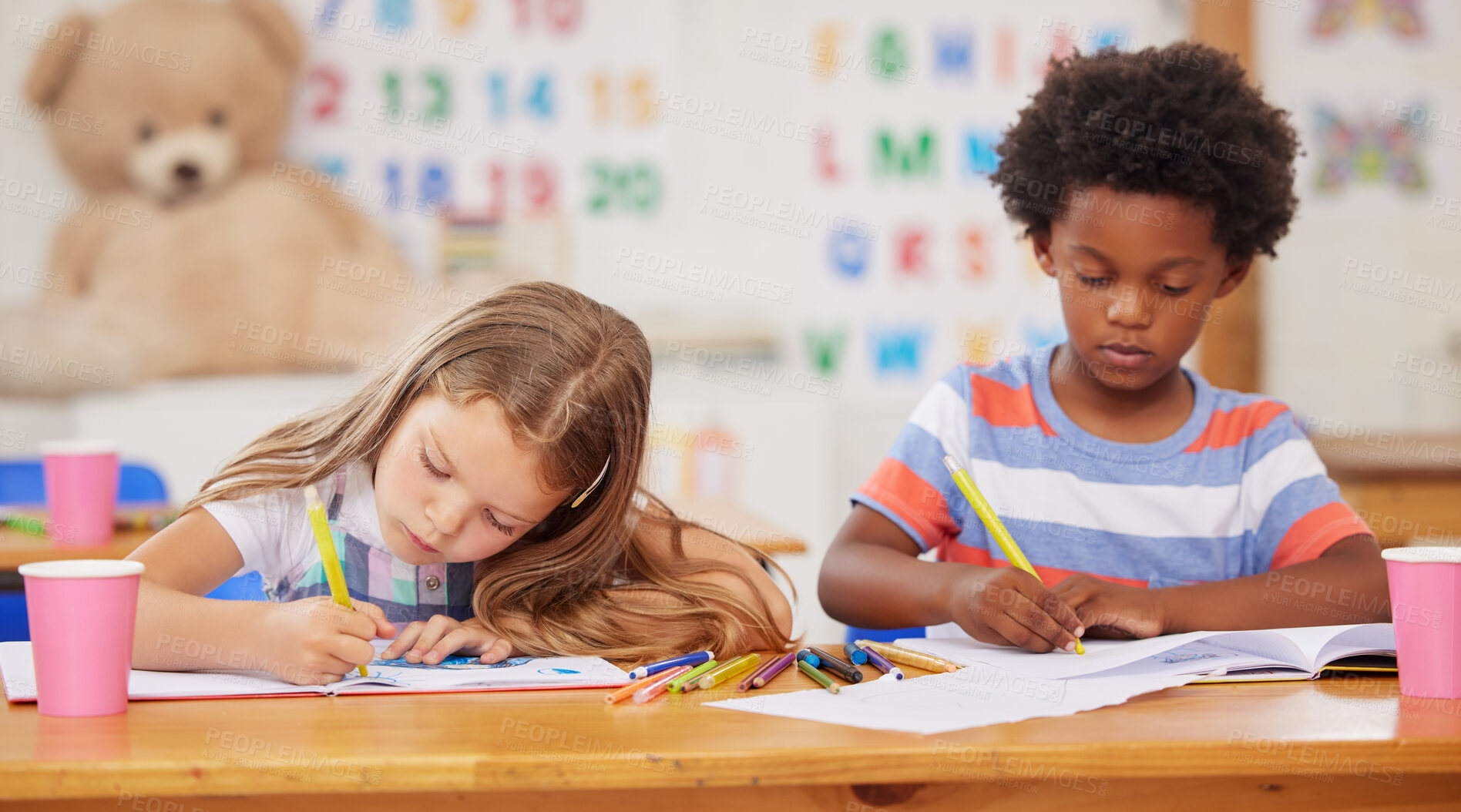 Buy stock photo Students, children and coloring in book in classroom for creative learning, growth development and art lesson. Montessori, friends and activity for education assessment, project or fine motor skills
