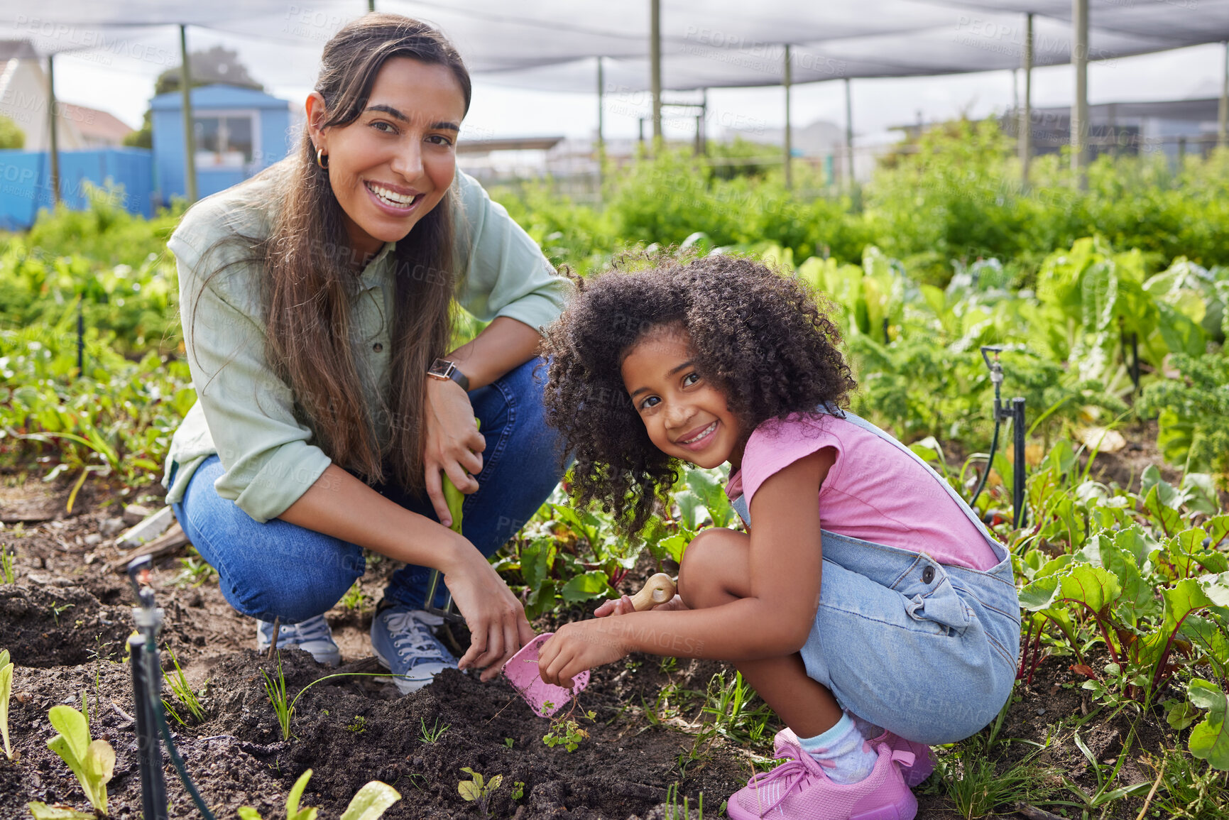 Buy stock photo Full length portrait of an attractive young woman and adorable little girl working on a farm