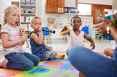Buy stock photo Shot of children learning about musical instruments in class
