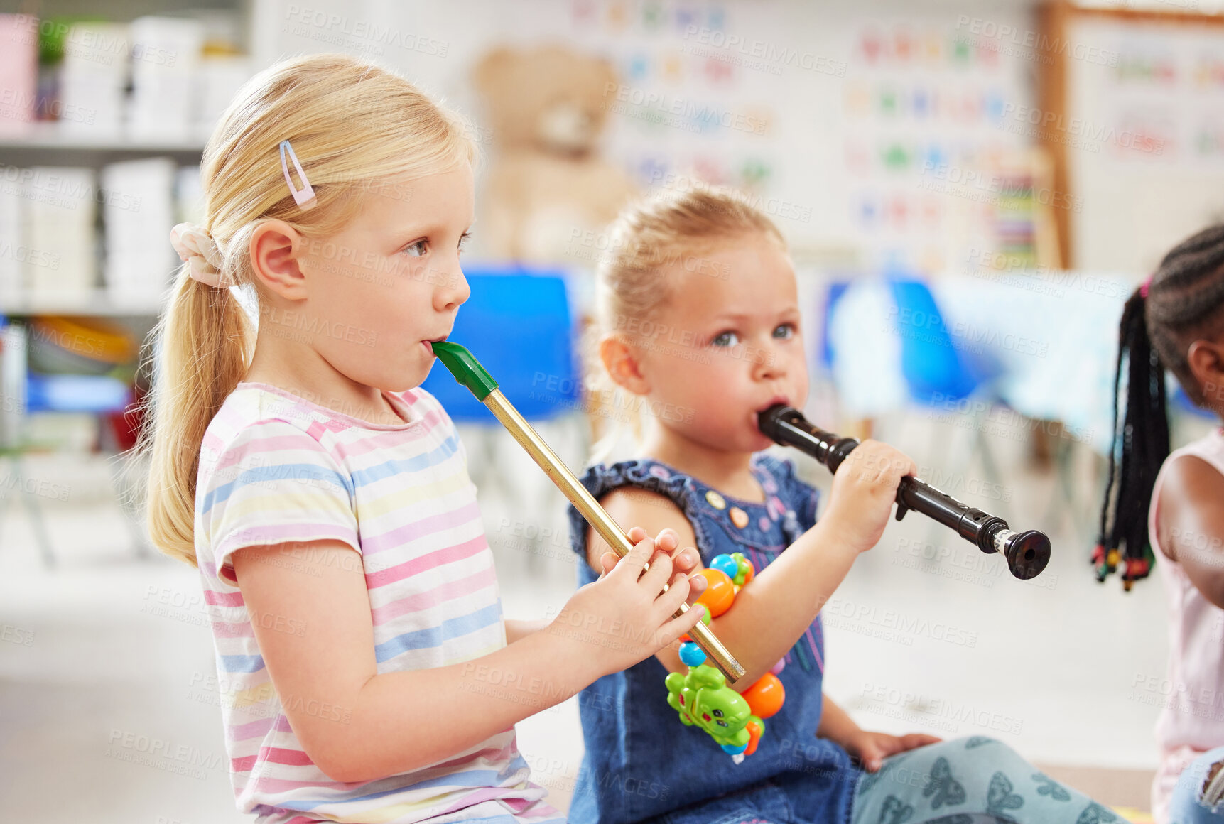 Buy stock photo Shot of children learning about musical instruments in class