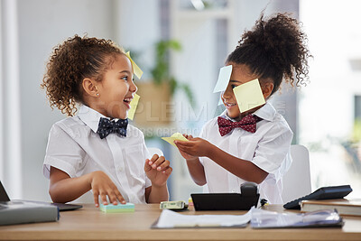 Buy stock photo Happy, playful and girls pretending to be business people, having fun with sticky notes and office equipment. Smile, funny and children playing dress up, play pretend and a game of work together