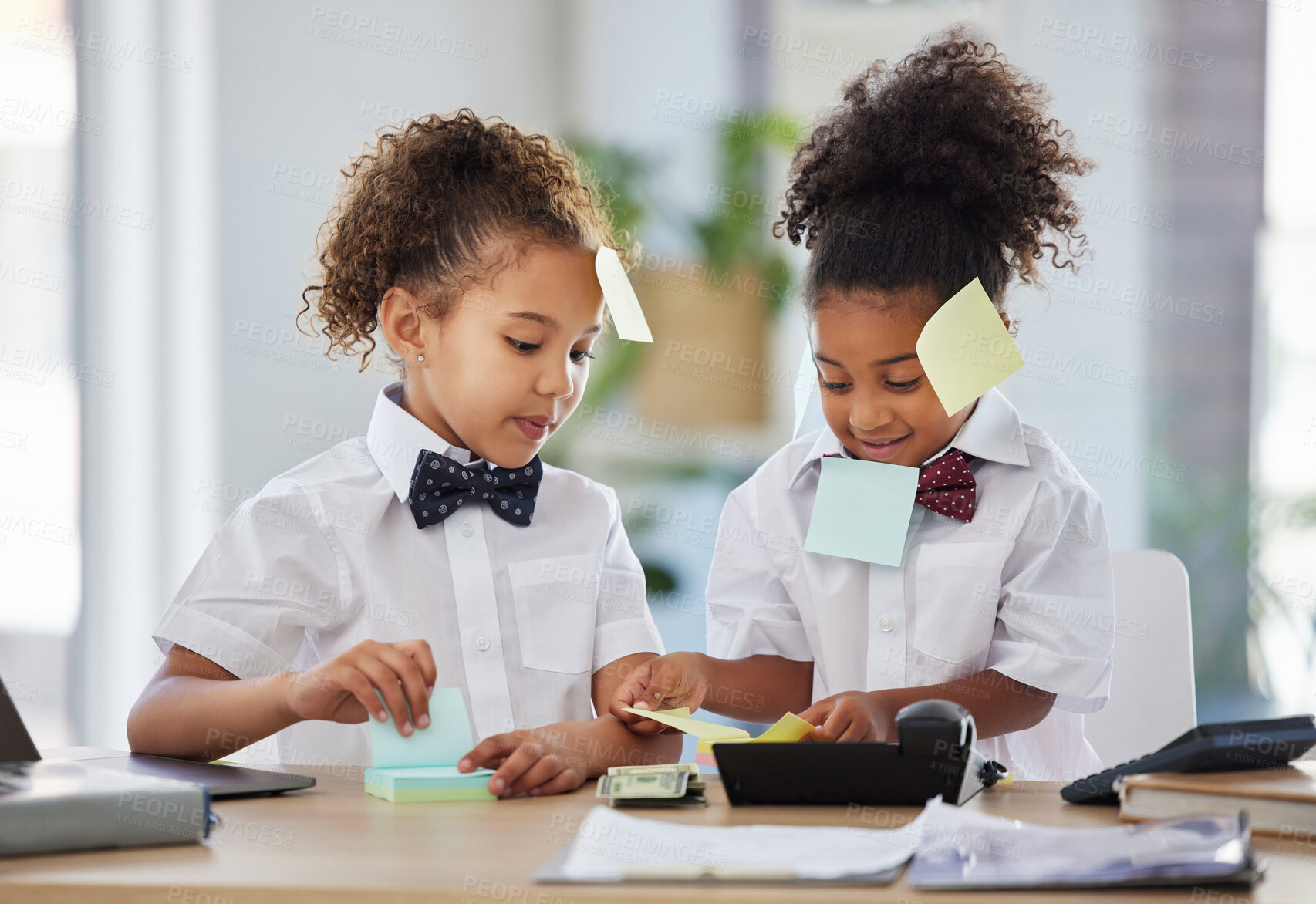 Buy stock photo Children, together and playing office with sticky note at desk with happiness, brainstorming and teamwork. Kids, girl and group with paper, planning and play as business people for bond with games