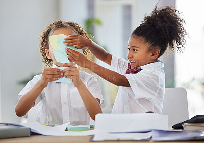 Buy stock photo Children, sticky note and face for play at office desk with happiness, brainstorming or teamwork at company. Kids, group girl and paper for planning, comic or playing as business people for bonding