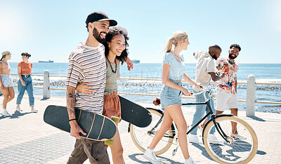 Buy stock photo Shot of a young couple waking together during a day outdoors with their friends