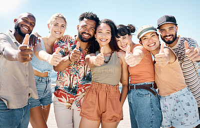 Buy stock photo Shot of a diverse group of friends standing outside together and showing a thumbs up
