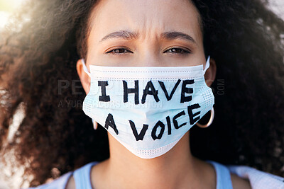 Buy stock photo Cropped portrait of a group of young people protesting in the city