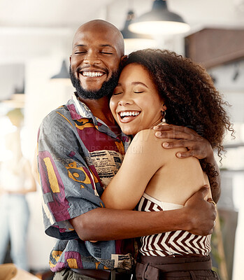 Buy stock photo Shot of a young couple hugging during a trip to a restaurant