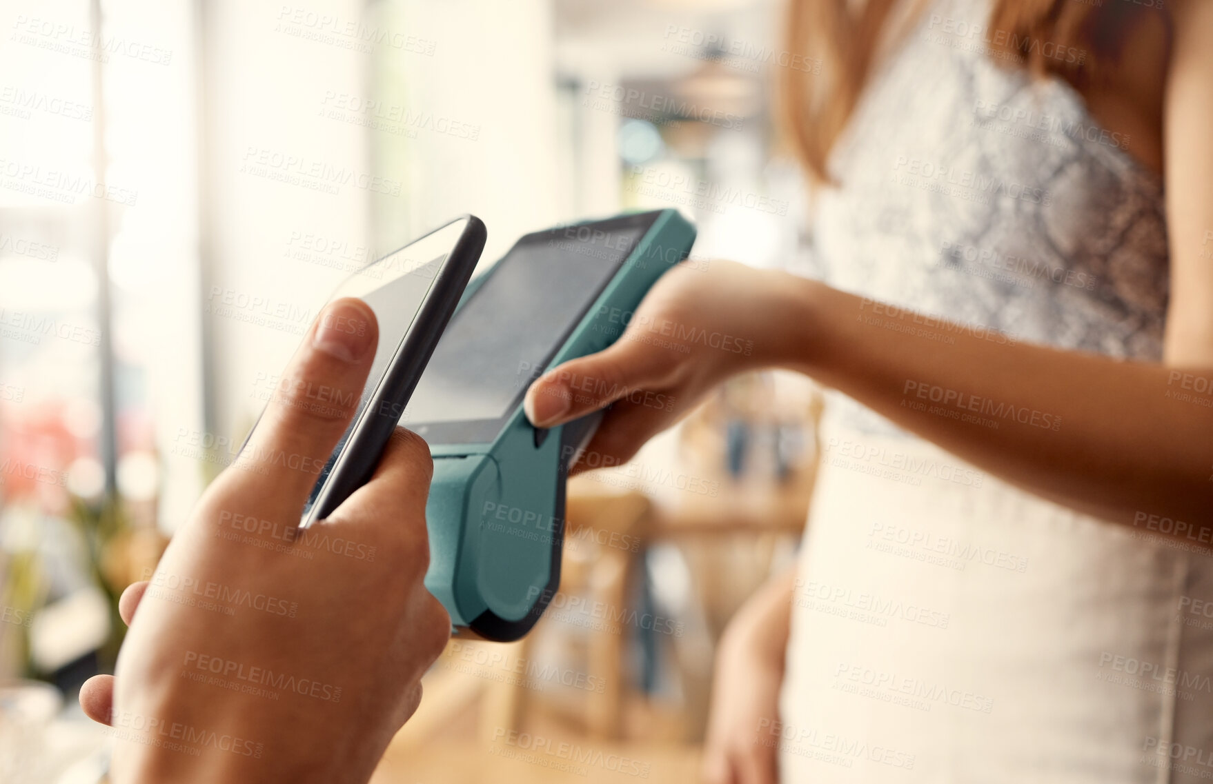 Buy stock photo Shot of a person using contactless payment with a smartphone at a restaurant