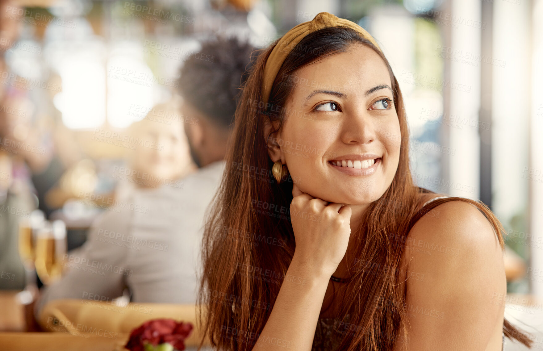 Buy stock photo Shot of a young woman enjoying some alone time at a cafe