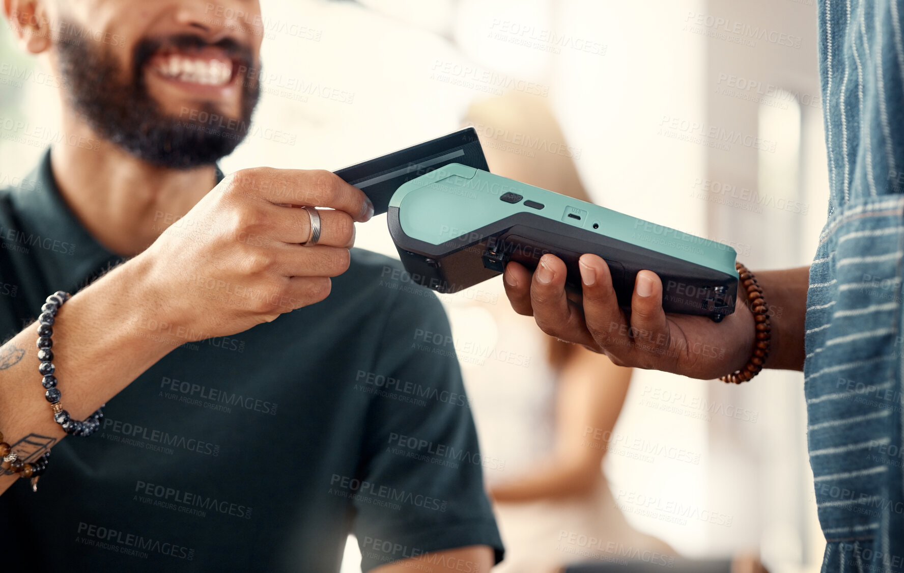 Buy stock photo Shot of a customer using a nfc to make a card payment in a restaurant