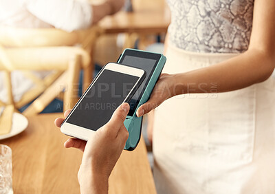 Buy stock photo Shot of a customer making a payment using their smartphone and a nfc machine