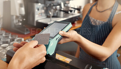 Buy stock photo Shot of a customer using a nfc machine to make a card payment at a restaurant