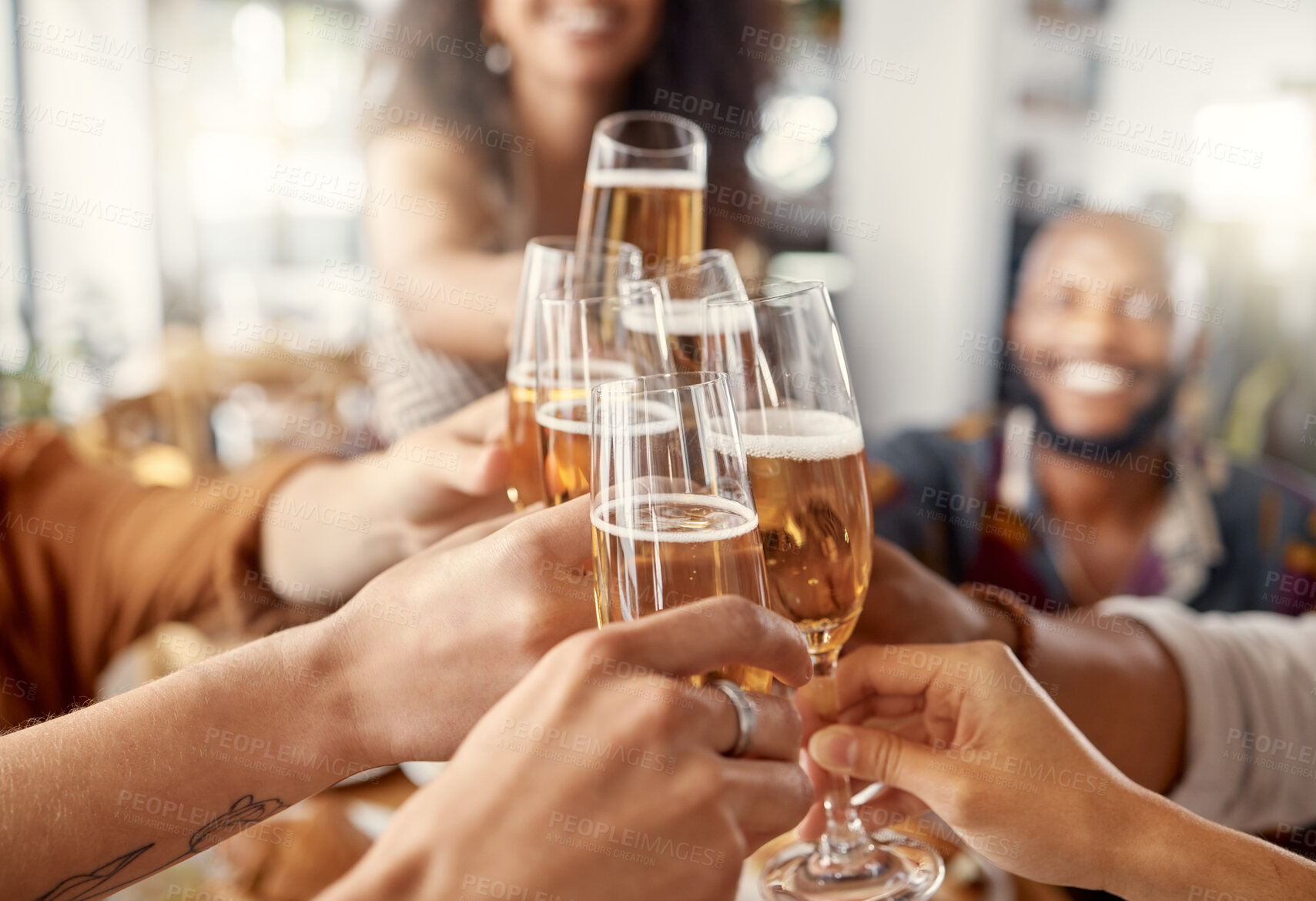 Buy stock photo Shot of a group of friends toasting in restaurant