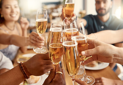 Buy stock photo Shot of a group of friends toasting in restaurant