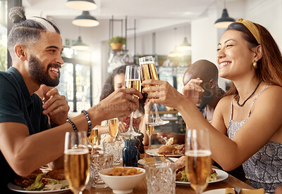 Buy stock photo Shot of a group of friends toasting in restaurant