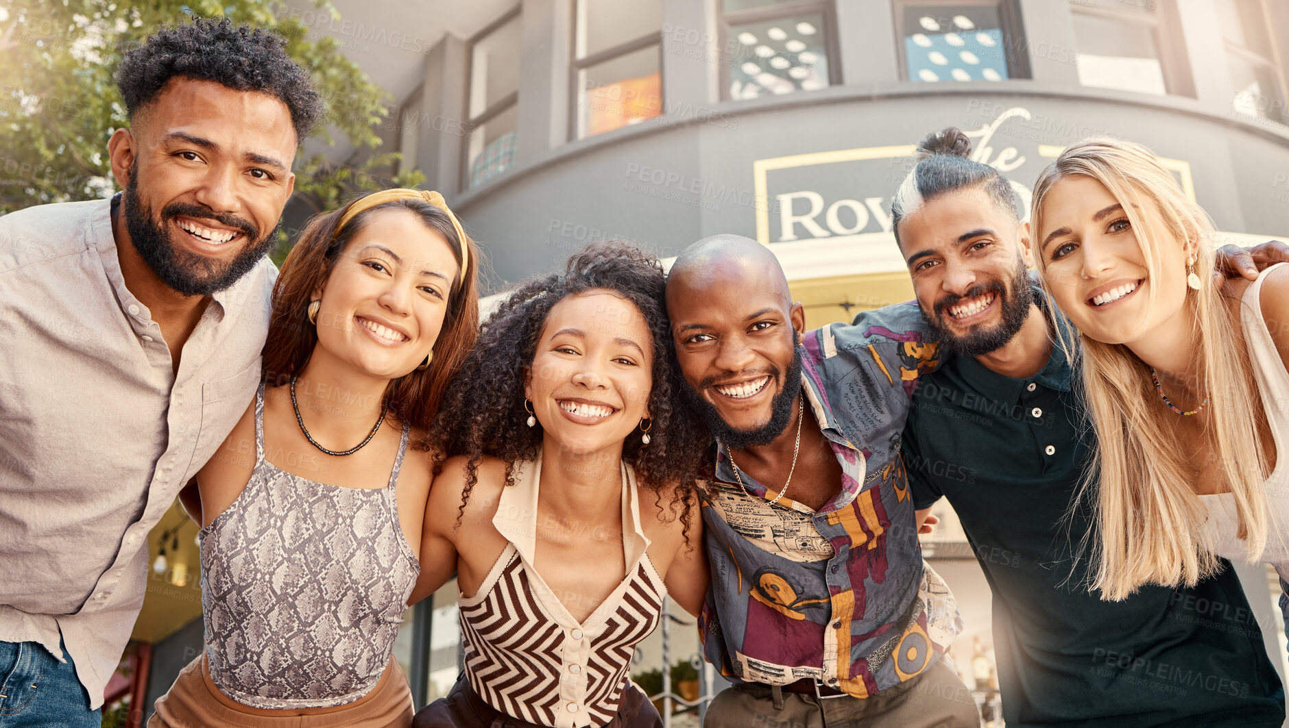 Buy stock photo Shot of a group of young friends taking selfies together at a restaurant