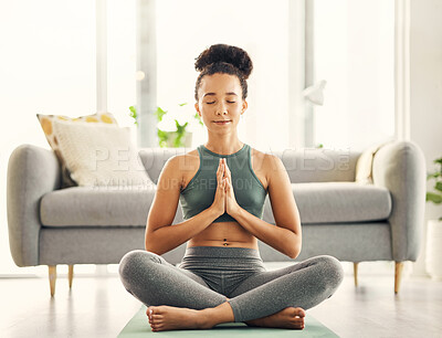 Buy stock photo Meditation, praying hands and woman relax on living room floor for peace, wellness or mental health at home. Prayer pose, yoga and lady meditate in lounge for zen, peace or holistic breathe exercise