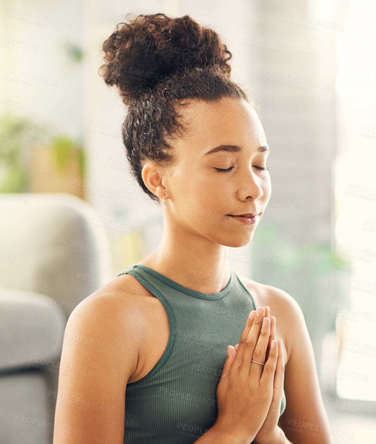 Buy stock photo Praying hands, meditation and woman relax in living room for peace, wellness or mental health balance at home. Prayer pose, yoga and lady meditate in lounge for zen, healing or holistic exercise