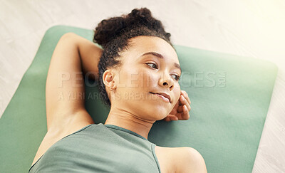 Buy stock photo Girl, relaxing and yoga mat on floor in closeup for wellness with peace in apartment or studio on weekend. Zen, woman and thinking with yogi for rest with balance at house to meditate with calm.