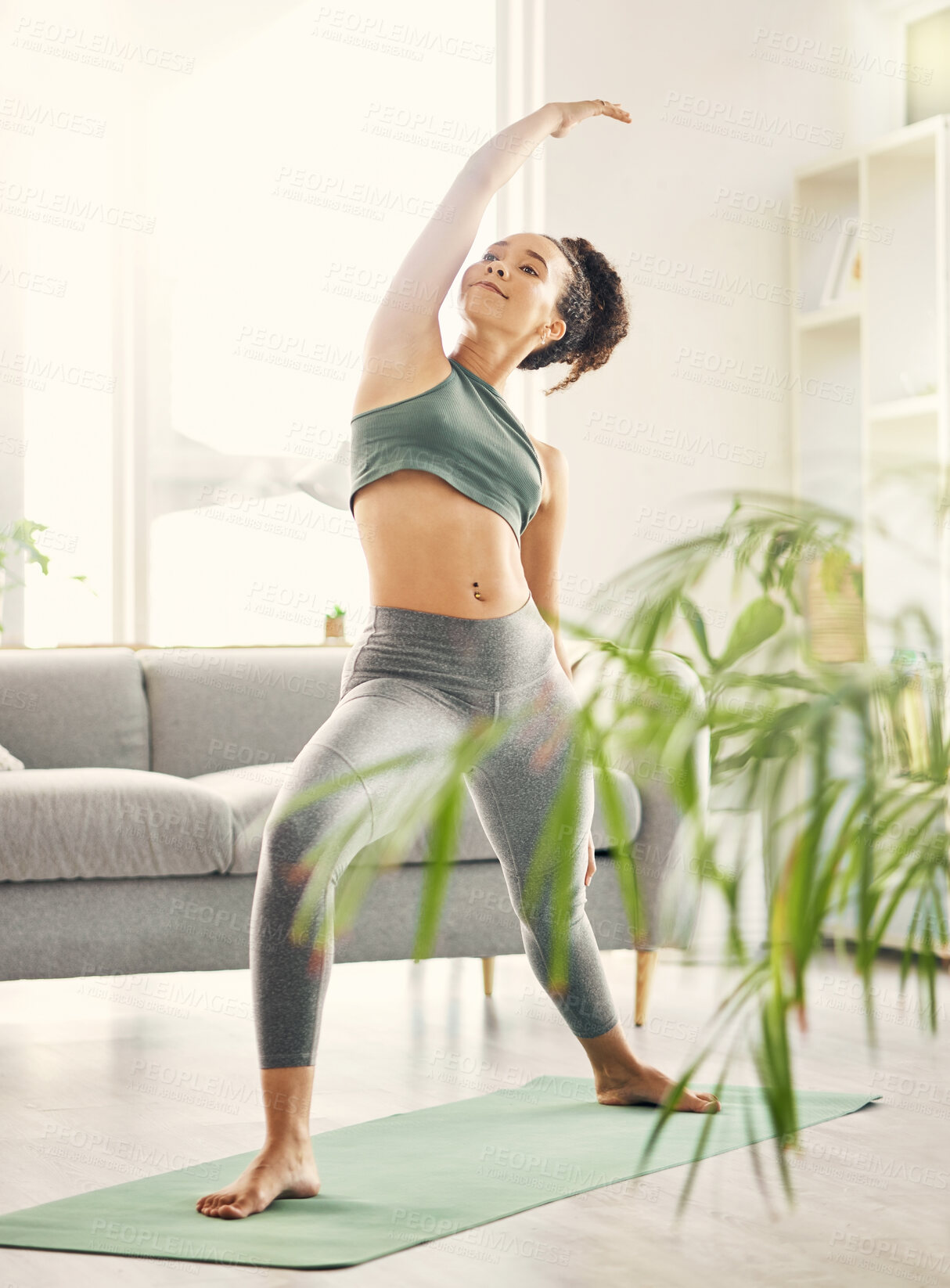 Buy stock photo Yoga, wellness and woman in home with zen, relax and spiritual practice in a living room. Young female person, apartment and lounge with pilates and flexibility exercise in house feeling calm