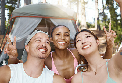 Buy stock photo Smile, peace sign and selfie of friends camping in forest, woods or nature together. Happy, v hand and people taking picture for hiking, social media emoji or group memory outdoor on summer vacation.