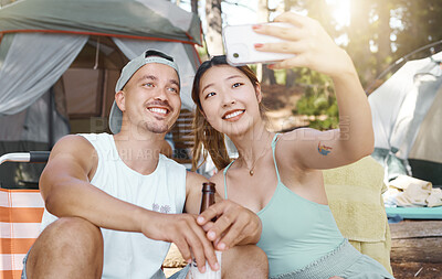 Buy stock photo Selfie, love and young couple on a camp in the woods for a summer weekend trip or holiday. Happy, smile and man with beer while his girlfriend taking a picture in forest on outdoor vacation together.