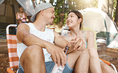 Buy stock photo Camping, love and a young couple in nature while in the forest or woods for travel and adventure. Hiking, relax and a man with his girlfriend drinking beer at their campsite outdoor in the wilderness