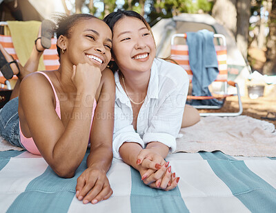 Buy stock photo Happy, relax and girl friends on a picnic while on camp weekend trip in the woods or nature. Happiness, smile and young interracial female people resting on blanket in outdoor park, garden or forest.