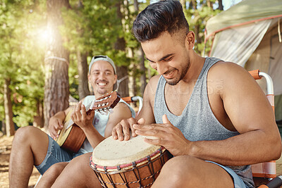 Buy stock photo Friends, men and playing music with guitar and drum on a summer camping, holiday in the woods, forest or nature. Musician, happiness and people together for musical performance, song or band