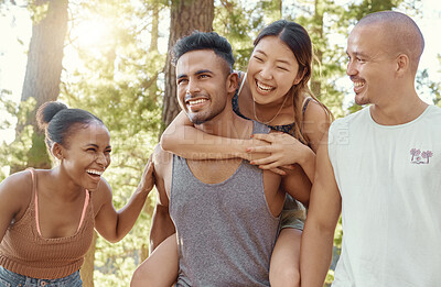 Buy stock photo Happy friends, laughing and piggyback in forest for fun holiday, weekend or vacation in the nature outdoors. Men and women enjoying funny time together in friendship on camping trip or walk in woods