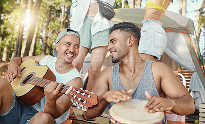 Buy stock photo Musician, friends and playing music with guitar and drum on a summer camping, holiday in the woods, forest or nature. Men, happiness and people together for musical performance, song or band