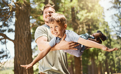 Buy stock photo Hiking, family and a boy flying with his father outdoor in nature while camping in the forest or woods. Love, fun and a young child son playing with his happy male parent in the summer wilderness