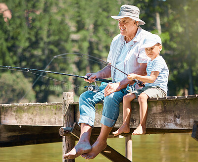 Buy stock photo Grandfather, boy and fishing rod at lake for hobby, adventure and teaching about nature. Young child, senior man and learning to fish at water by river dock, weekend camping trip and outdoor holiday