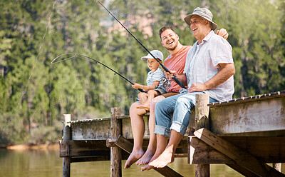 Buy stock photo Happy father, grandfather and child fishing at lake together for fun bonding or peaceful time in nature. Dad, grandpa and kid enjoying life, catch or fish with rod by water pond or river in forest