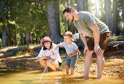 Buy stock photo Family, son and fishing net at lake for holiday or fun with happiness or adventure in summer. Vacation, parents and boy with water at forest for travel with mother and father for quality time. 