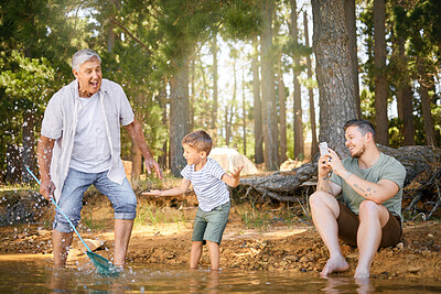 Buy stock photo Nature, lake and child with his grandfather and father playing, fishing and bonding on a vacation. Travel, happy and senior man having fun with adult son and grandchild in the woods on a weekend trip