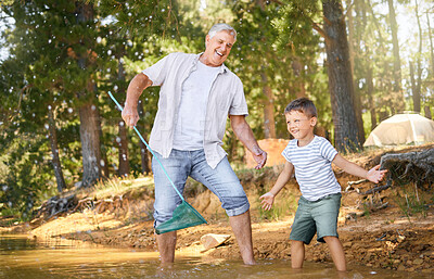 Buy stock photo Happy, grandparent teaching child with fishing net and at lake with a lens flare in forest for support. Camp or freedom, collaboration or teamwork and people learning how to fish together at river