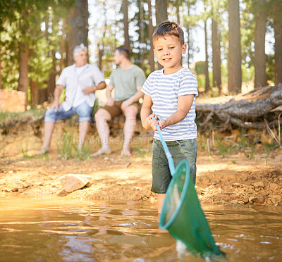 Buy stock photo Nature, fishing and child with net in river, fun and happy time on camping holiday weekend in woods. Lake, forest and relax in trees, boy catching fish in water on adventure on happy family vacation.
